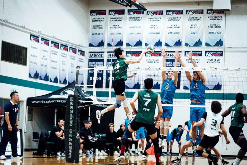 Owen Lam (#4), Douglas College Royals' outside hitter and PACWEST player of the year, spikes the ball during the gold medal game of the 2023-24 men's volleyball championships at the New Westminster school.