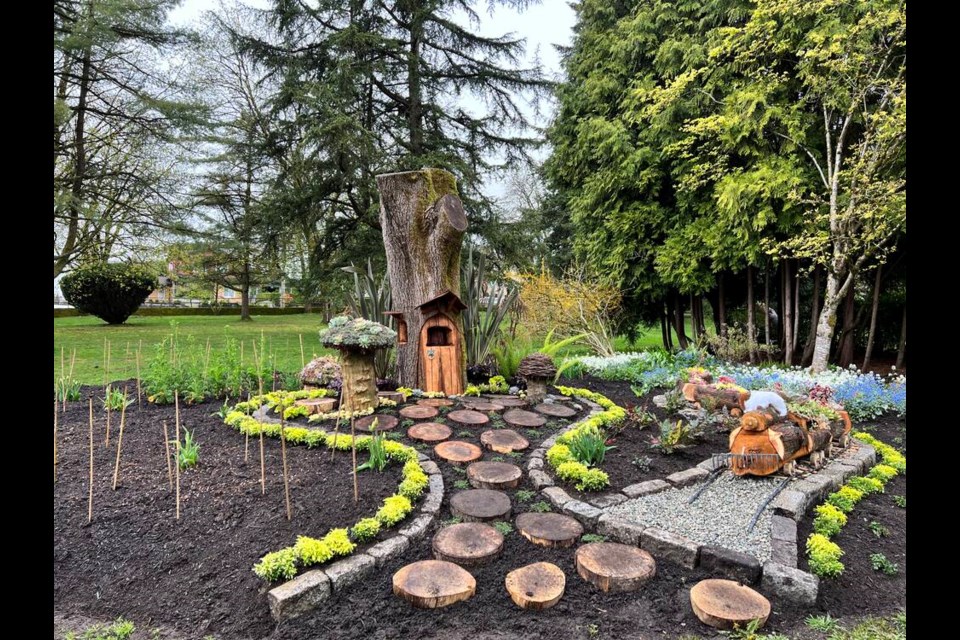 An old tree at Queen's Park, New Westminster, has been transformed into a 'Fairy House' by artist-gardener Ron Rebko. Photo Abhinaya Natesh 