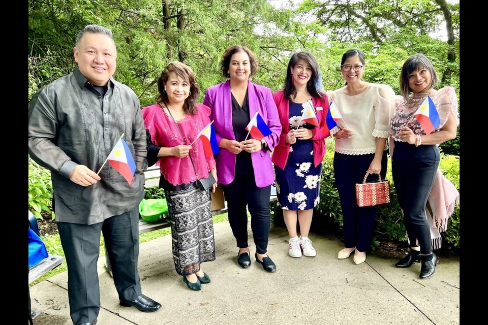 Flag raising: Members of the Filipino community and the city recently gathered for a flag-raising in honour of Philippine Independence Day. photo Filipino-Canadian Society for International Arts and Events 