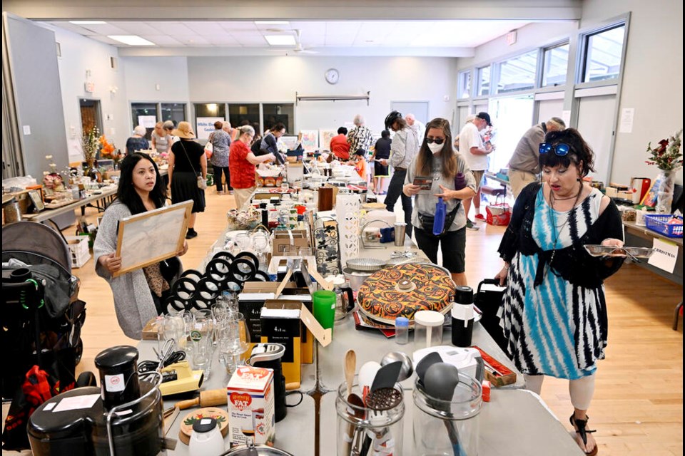 Shoppers enjoy an array of choices at the Century House bazaar on Saturday.
Photo Jennifer Gauthier