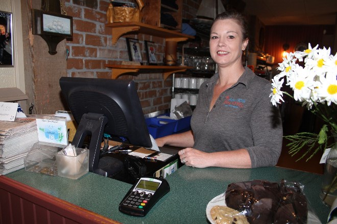 Denise Callaghan works the till in the dining area of the Anchor Inn. As of July 1 she and husband Chris are the new owners of the historic bar and restaurant. The couple purchased all the shares for the the business earlier this year from original owners Bruce and Kelly O'Hare and partner Rob Norris. Denise is a familiar face as a longtime employee and says she has no plans to make major changes to the menu or the business.