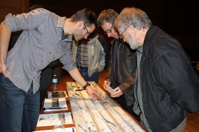 Attila Pentek, left, senior geologist at Wallbridge Mining Company Limited, answers questions on core samples taken from the Fenelon Gold Property in northern Quebec the mining company has been exploring.