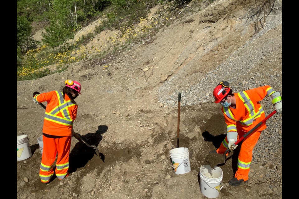 Students and research-assistants Danny-Elle Henri and Brodie Chisholm collecting soil samples on an old aggregate site. (Collège Boréal photo)