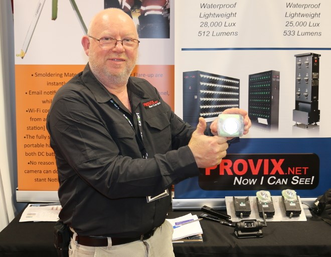 Provix president Dave Winfield displays his palm-sized cap lamp unit at the Big Event Mine Expo in Timmins. (Len Gillis photo)