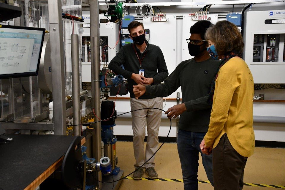 Student Sachin Raj Sampath (centre) demonstrates instrumentation equipment for Confederation College President Kathleen Lynch and Lakeside Team Lead of Regional Services Chris Foulds. (Supplied photo)