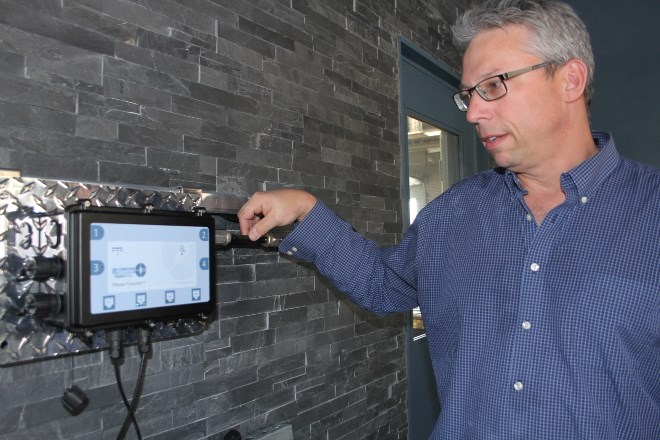 David Ballantyne, vice-president of product development, with a Plexus Powernet, which is currently running a lighted sign in Maestro Digital Mine's office in Lively. The system uses copper coaxial cable, the same kind that used in cable TV and Internet transmissions, as a durable and efficient way to get data from the mine face to the command centre. 