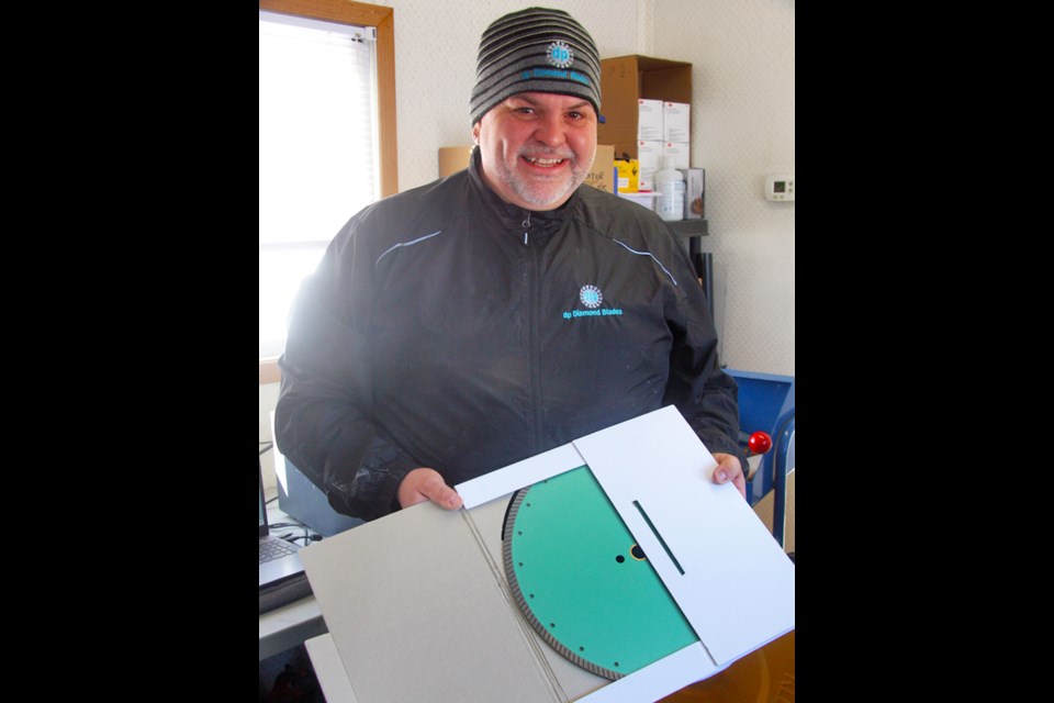 "Diamond Dave" Pykari displays one of his specially designed blades for core sample cutting (Graham Strong photo)