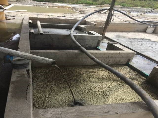 Concentrate settling ponds at Ponce Enriquez, Ecuador with tailings in the background. (BacTech photo).