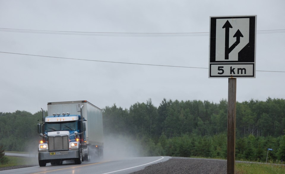 Highway 11 passing lane sign