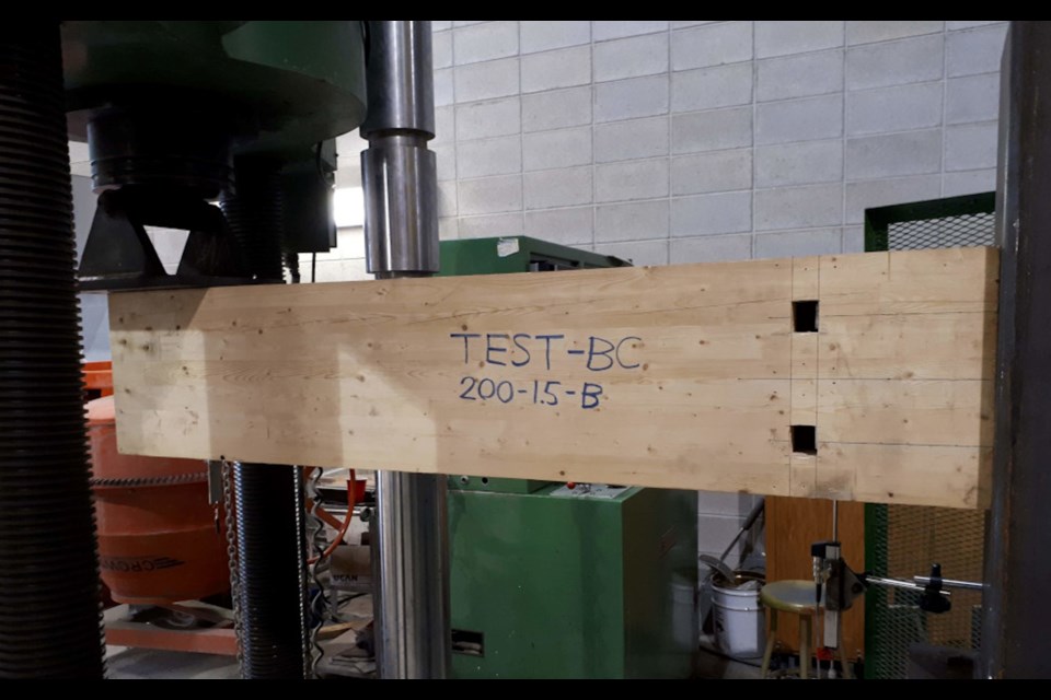 Professor Sam Salem and grad student Cory Hubbard timber beam-column connection (Supplied)