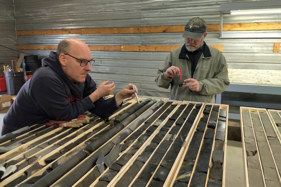 Technical Advisor Robert Carpenter and technical consultant Dave Skelton examine historic drilling core from the Miminiska Gold Project near Eabametoong. (Lithoquest Resources)

