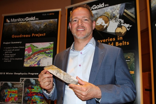 Pat Dubreuil, president of Manitou Gold, shows off a piece of a famous core sample taken from the company's Kenwest project, which indicated 53,000 grams per tonne ounces of gold at 0.53 metres. Half the core sample was processed and 1.6 ounces of pure gold was recovered. 