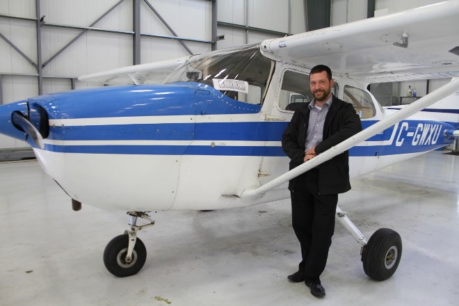 Matt Neumann, chief flight instructor and training coordinator at Discovery Aviation Academy, now Mag Aerospace Canada in Sudbury stands by a Cessna 172, one of the training planes they use to teach students how to fly at the flight school department of the company. 