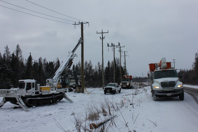 PowerTel connects the first pole to the distribution system.(Opiikapawiin Services LP photo)