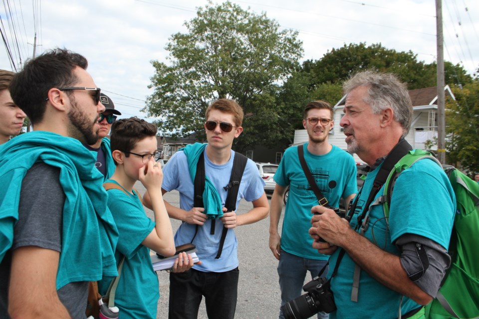 Ted Wilson, professor of sustainable design and third year coordinator at the McEwen School of Architecture chats with students before they head to designated areas to gather design and historical information on Laforest Street. (Karen McKinley photo)