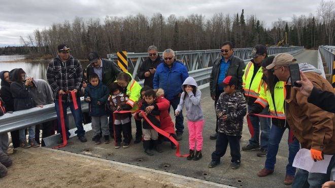 North Caribou Lake First Nation community members gathered at the new bridge crossing the Weagamou Lake narrows to mark the opening of a new bridge that will give the community year-round access. (NAN photo)