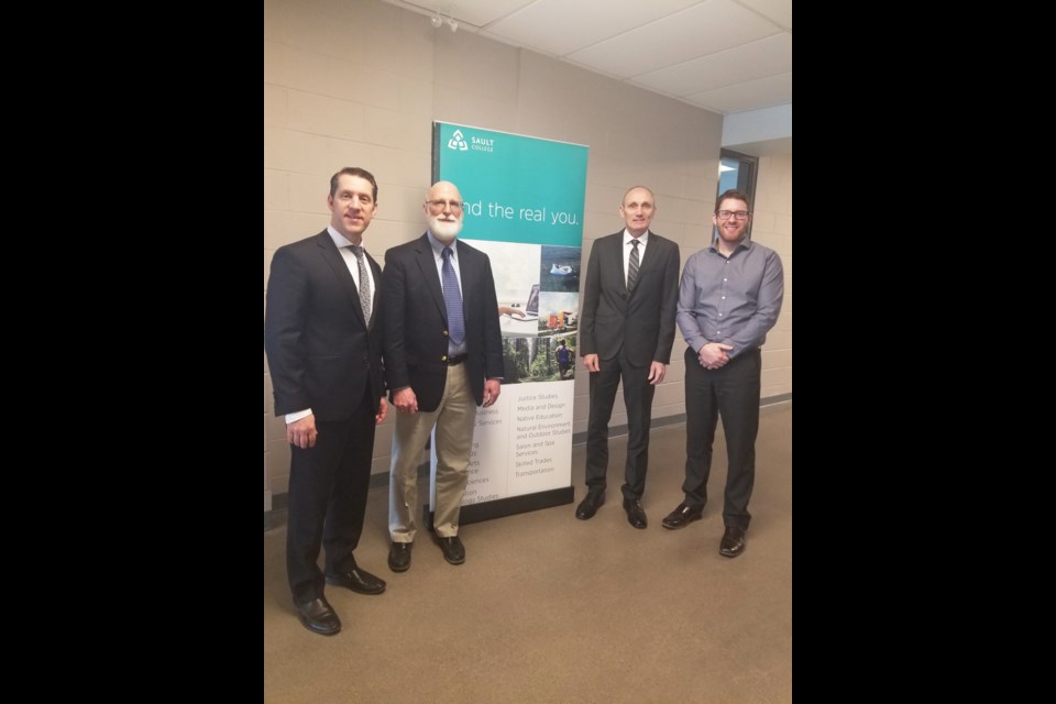 On hand for the signing were (from left): David Orazietti, dean of aviation, trades and technology, natural environment and business at Sault College; Dr. Stephen J. Havlovic, dean with the faculty of management at Laurentian University; Colin Kirkwood, vice-president of academic and research at Sault College; and Chris Mercer, associate vice-president of student life, enrolment, and international at Laurentian University. (Supplied photo)