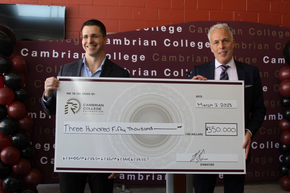 Peter Xavier (left), vice-president of Sudbury Integrated Nickel Operations – A Glencore Company, presented a cheque for $350,000 to Shawn Poland, interim president, on March 2 at Cambrian College. The funding will go toward the new battery-electric vehicle lab at Cambrian's Glencore Centre for Innovation, which is currently under construction.
