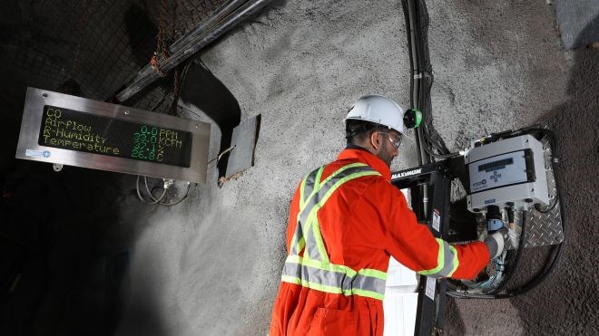 A technician works on a Vigilante AQS™ system installed in a mine. The system was developed as an answer to the logistical and technical problems ultra-deep mining brings to ventilation by making it completely self-contained, light, less expensive and easy to monitor. 