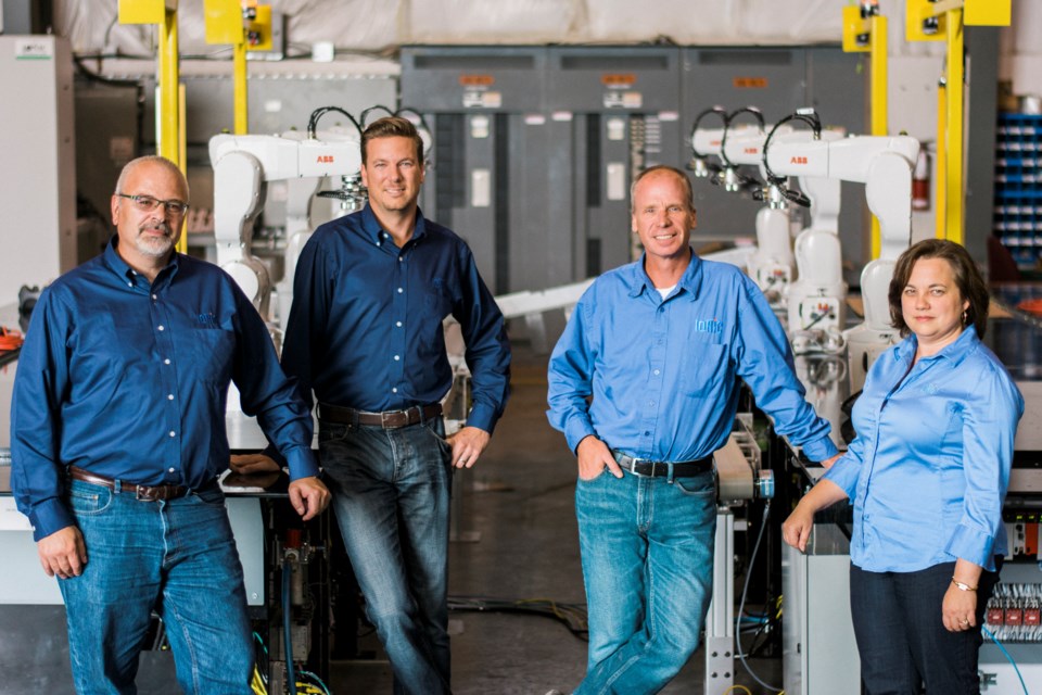 Steve Matusch (second from right) is pictured with the team at Black Rock Engineering in 2015. (File photo)