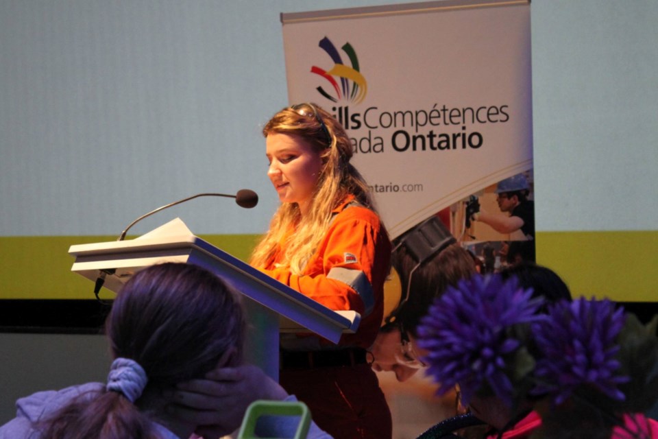 Kendra Liinamaa, an apprentice millwright with Vale, speaks to a group of elementary school aged girls during an International Day of the Girl event in Sudbury, hosted at Science North by Skills Ontario.