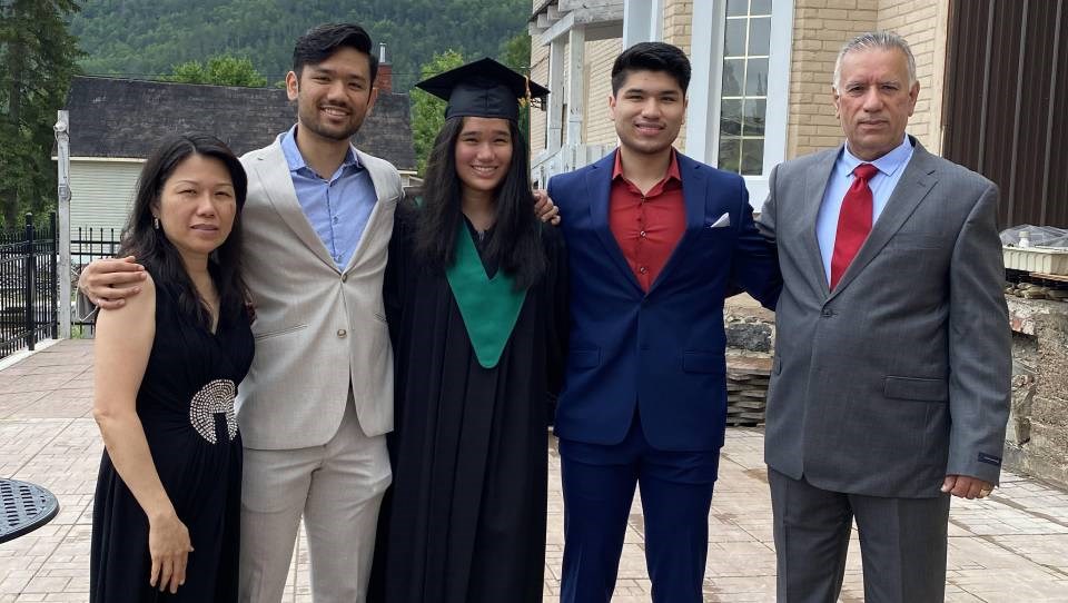 The Butt family includes (from left) Sudawan, Danish, Harris, Angela, and Quaisar. After immigrating from Thailand in 2006, the family has worked hard to transform Le Voyageur Inn into a cozy tourist haven.