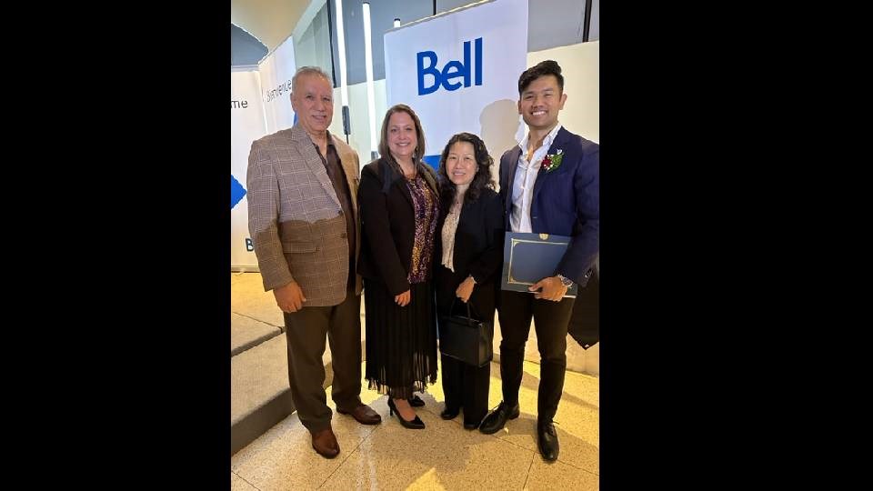 The Butt family — Quaisar, Sudawan, and Danish — are joined by North Bay & District Chamber of Commerce president-CEO Donna Backer (second from left) to receive their 2023 Small Business of the Year Award.