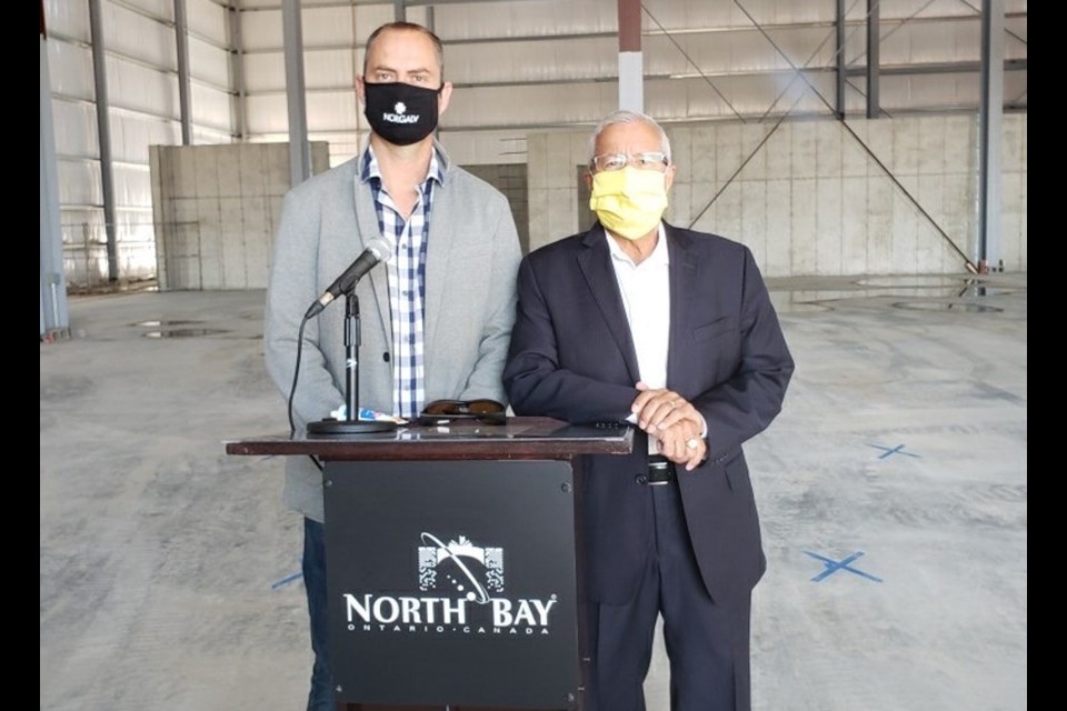 André van Soelen (left), managing director at Norgalv, and Vic Fedeli, Nipissing MPP, marked the pouring of the concrete pad at the company's 35,000-sqaure-foot hot dip galvanizing plant in North Bay on Aug. 14. (Supplied photo)