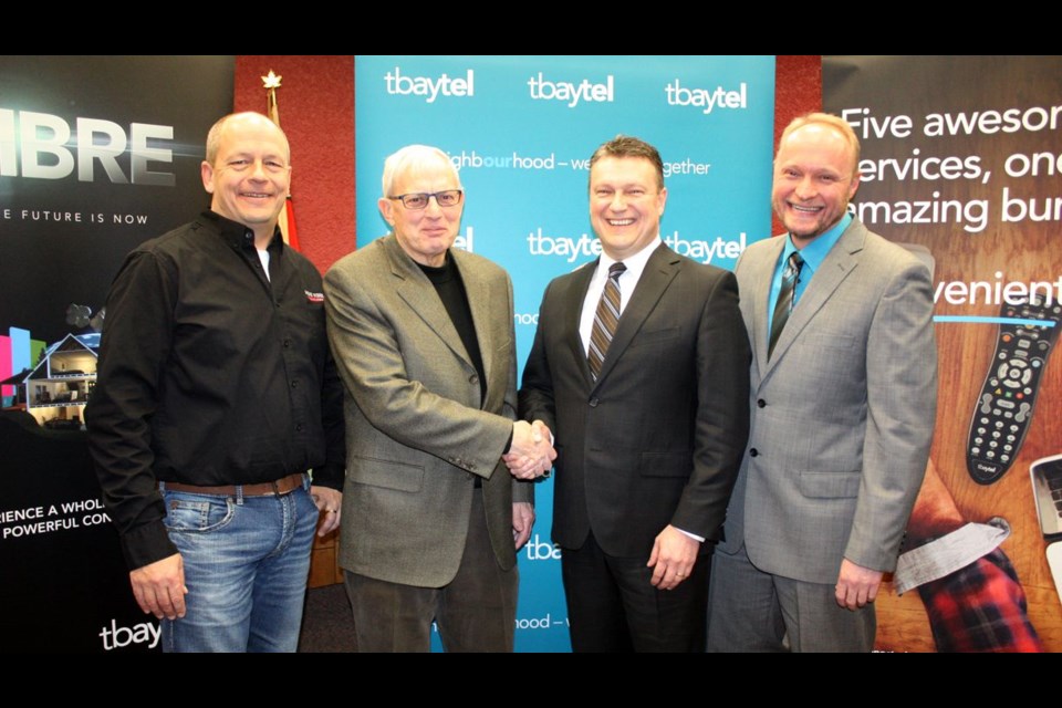 Tbaytel has announced it's expanding fibre-optic technology to Fort Frances. Pictured are (from left) Derek Jackson, owner of Sight & Sound Audio Video; Fort Frances Mayor Roy Avis; Tbaytel president and CEO Dan Topatigh; and Joerg Ruppenstein,  president and CEO of Fort Frances Power Corp. Duane Hicks photo/Fort Frances Times