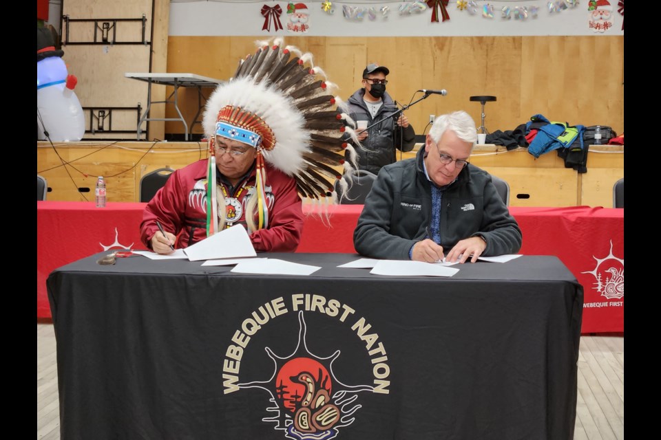 Webequie Chief Cornelius Wabasse and Ring of Fire Metals acting CEO Stephen Flewelling seal the deal on an exploration MOU (Supplied)