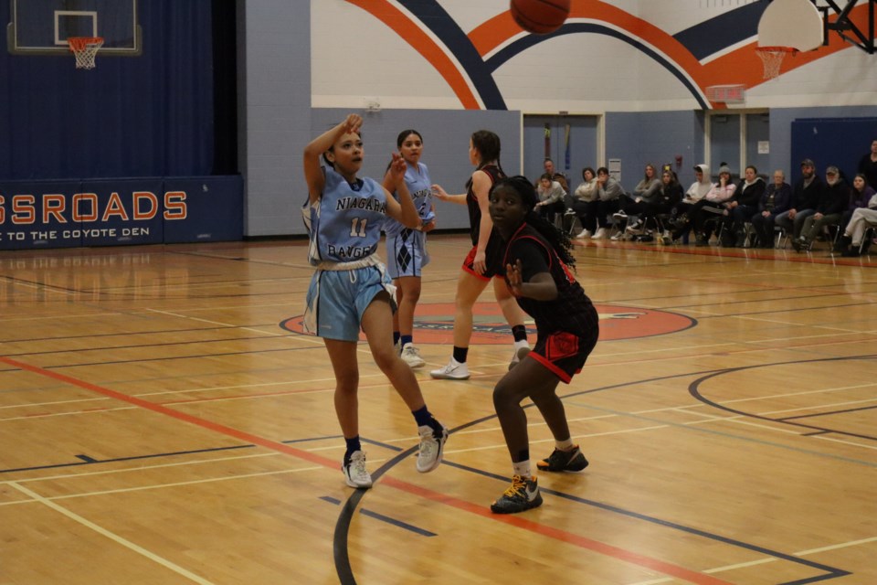 Jailah Gabbidon passes the ball to a Rangers teammate.