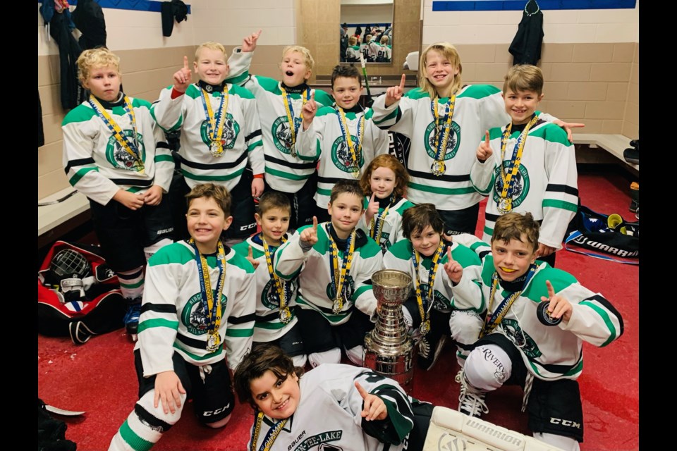 Celebrating being #1 are the U9 Wolves: (back left) Hunter Berry, Will Lidstone, Bentley Berry, Colton Meleskie, Dean Pagnotta, Leo Pillitteri; (middle) Nash Funk, Ryan Riddle, Nicholas Riddle, Russell Palmer, Owen Thorimbert, Jacob Rogers; and (front) goalie Peter Kotsanis. 