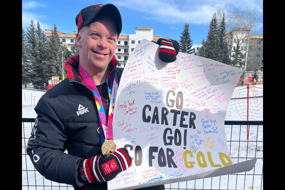The sign must have worked! Carter indeed captured the gold medal in the Super G in Calgary. 