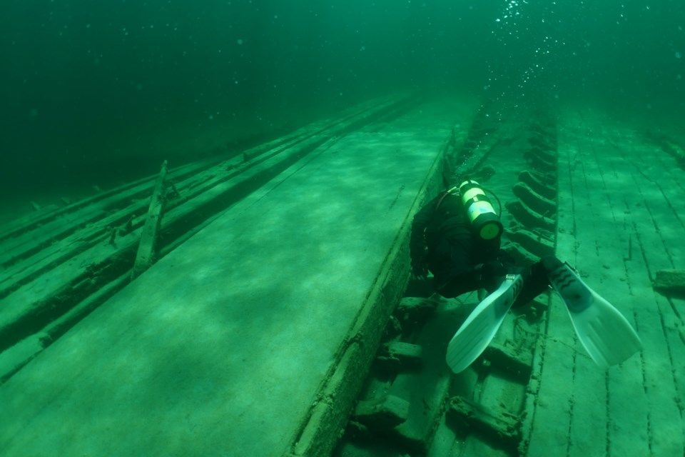 A diver swims past the centreboard of the Lottie Wolf. | David Gilchrist/Photo