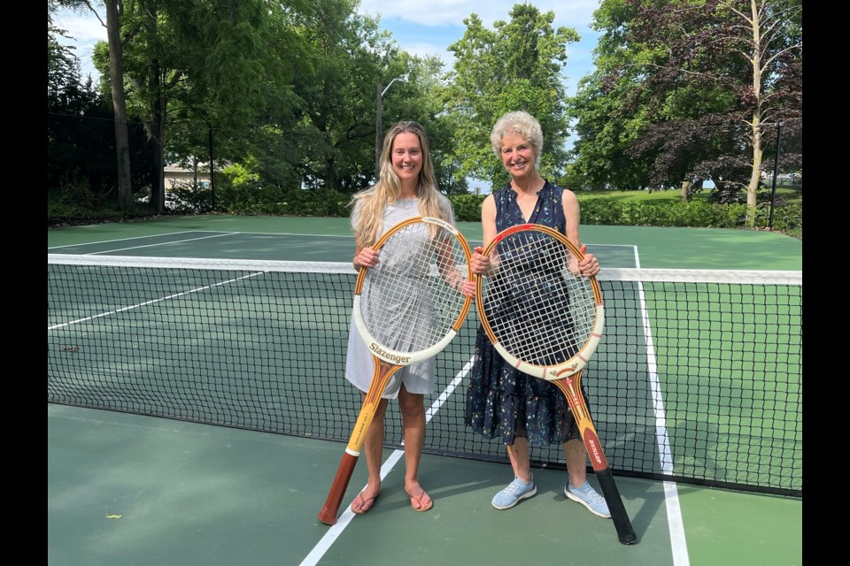 Robin Ridesic and Rosemary Goodwin on the court behind Ridesic's home where the Davis Cup will be on display Thursday, August 3