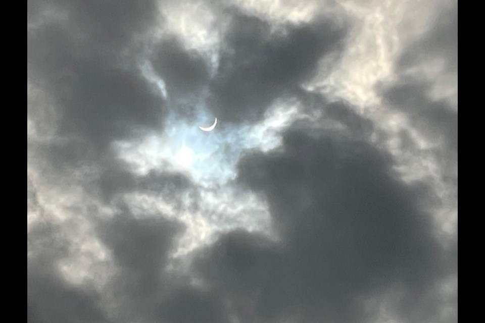 The eclipse as it broke through the clouds in Queenston.