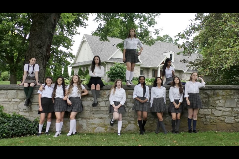 A group of students gathers outside their academy for Red Letter Day . (Photos supplied)