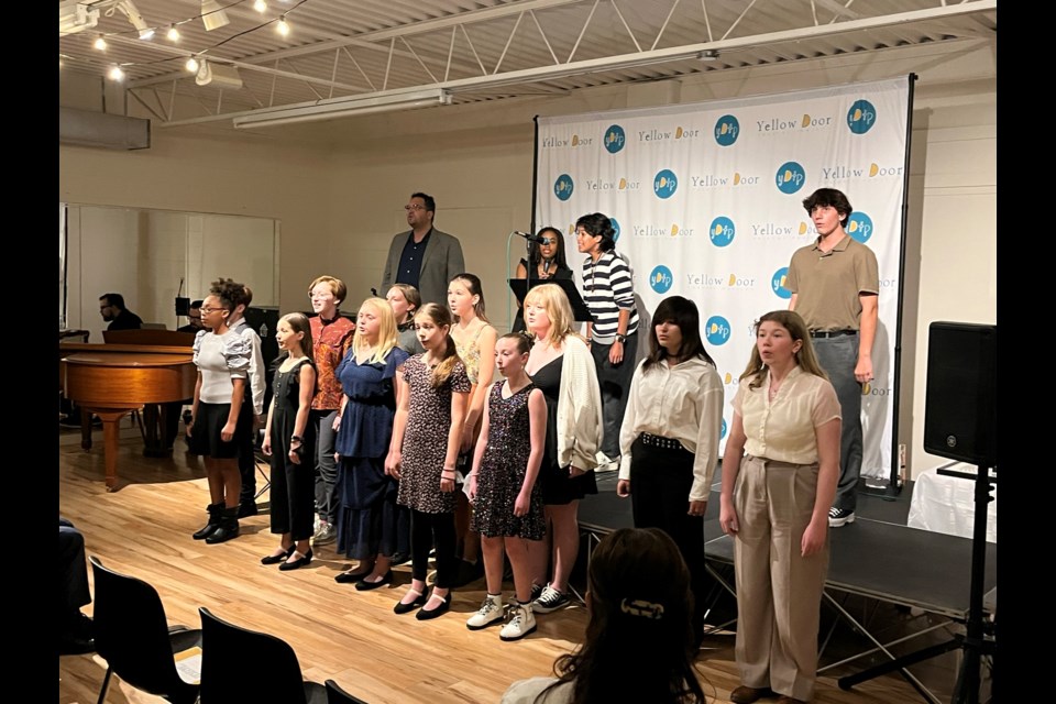 The cast of Nobody’s Children performs a song from the musical to a crowd gathered at the Yellow Door studio. (Photos by Mike Balsom)