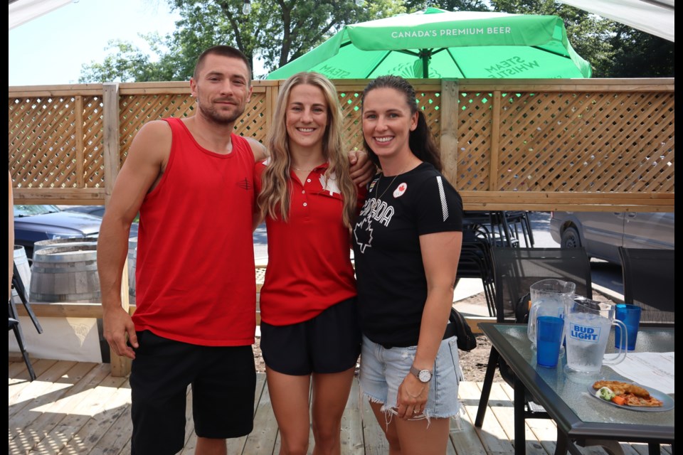 Trainer and coach Jesse Sallows, McKenzie Wright, two-time Olympian Mandy Bujold at the Sandtrap fundraiser