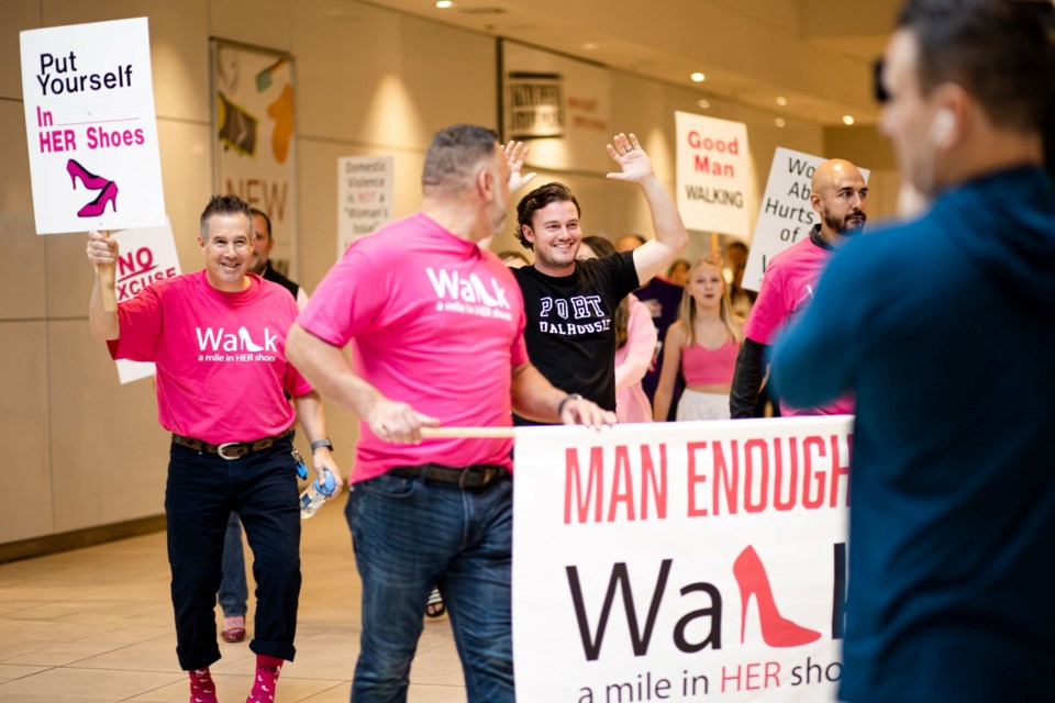 Mike Balsom (far left) participated as an ambassador in 2022's Walk A Mile in Her Shoes fundraiser