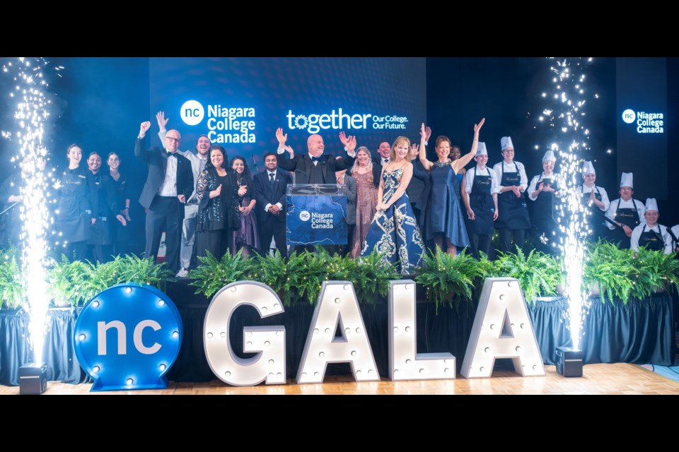 With Niagara College students behind him, president Sean Kennedy (at podium) announces the $50 million Together campaign at the school's annual gala. 
