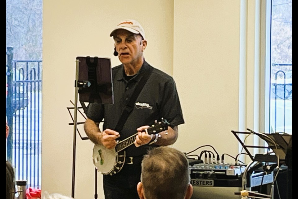 Alan Ash plays his 'banjolele' and leads the NOTL Ukesters through a rendition of the Etta James song "Look for the Silver Lining" at a recent session at the Coummunity Centre.