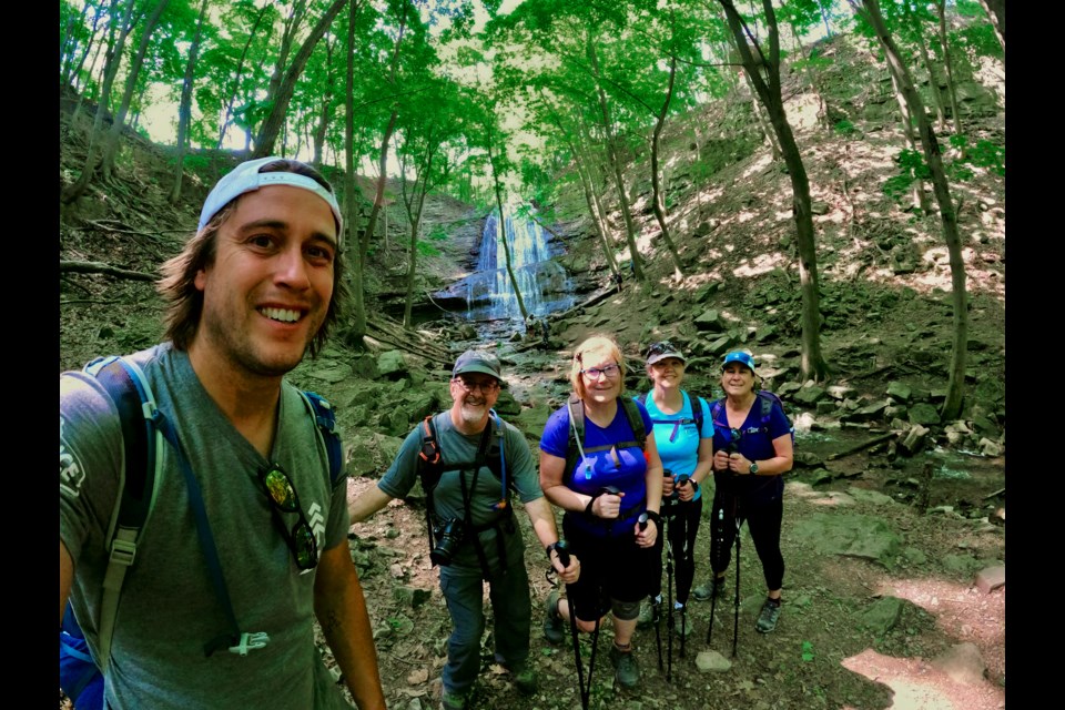 Owen Bjorgan with guests for a Bruce Trail glamping experience in Hamilton this weekend.