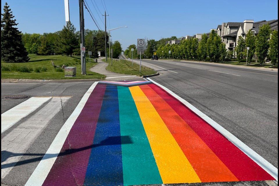 Happy Pride Month: NOTL makes it just in time with the installation Monday evening of a rainbow crosswalk across Anderson Lane at Mississagua Street.