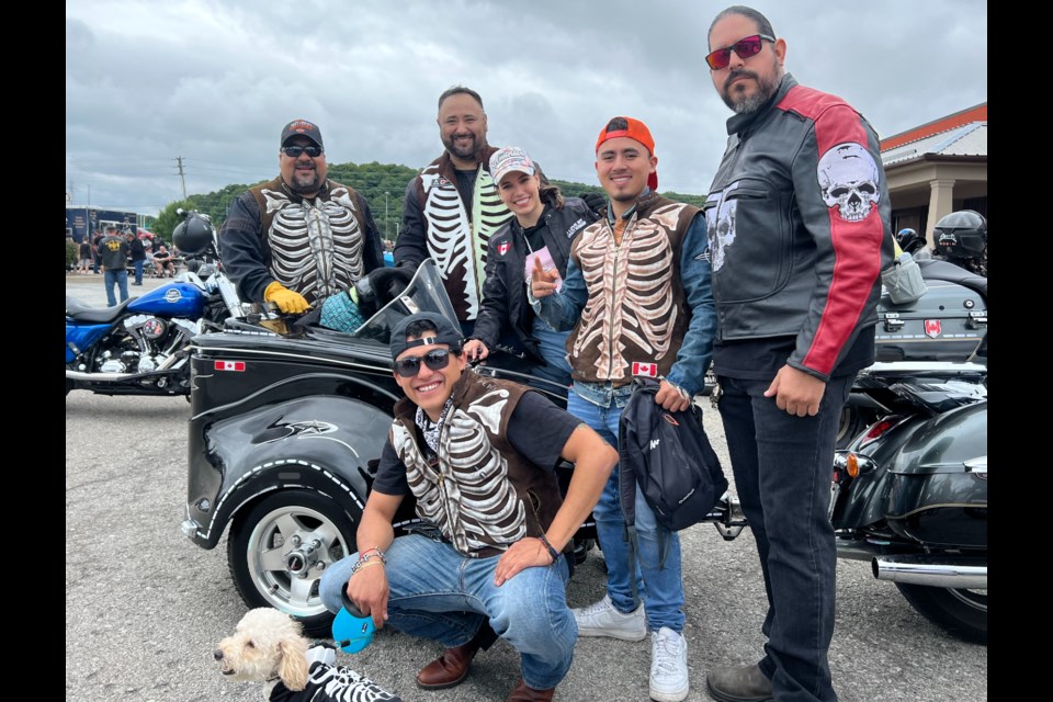 Seated with dog Nacho is Alberto Fuentes Standin are Horno Fuentes, Jamie Leal, Danielle Lisi, Alex Fuentes and Saul Azurbia.