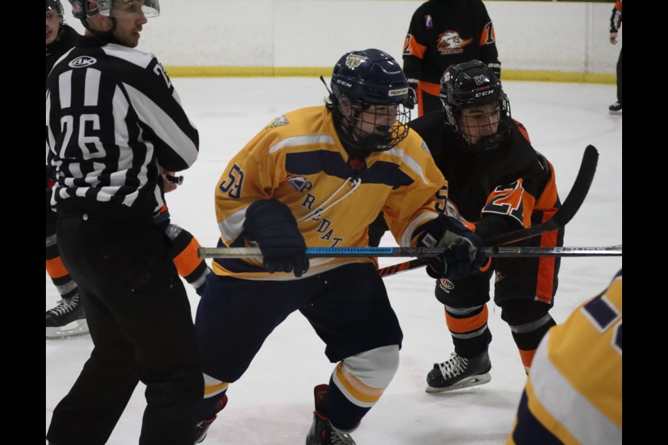 Shane Kaplan of the Predators and his older brother Jackson of the Roadrunners following a face-off against each other in a December 15 game in Virgil. 