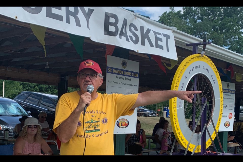 Lion Martin Forster spinning the grocery basket wheel at last year's St. Davids Lions Carnival.