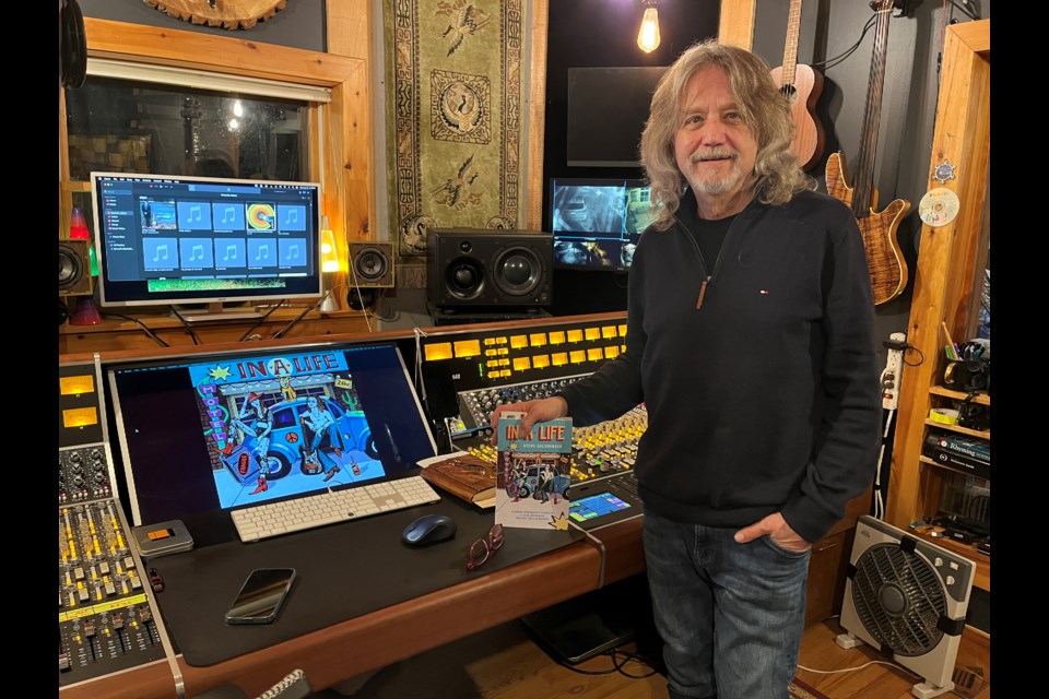 Steve Goldberger holds a copy of his new memoir 'In A Life' in his NOTL recording studio. 