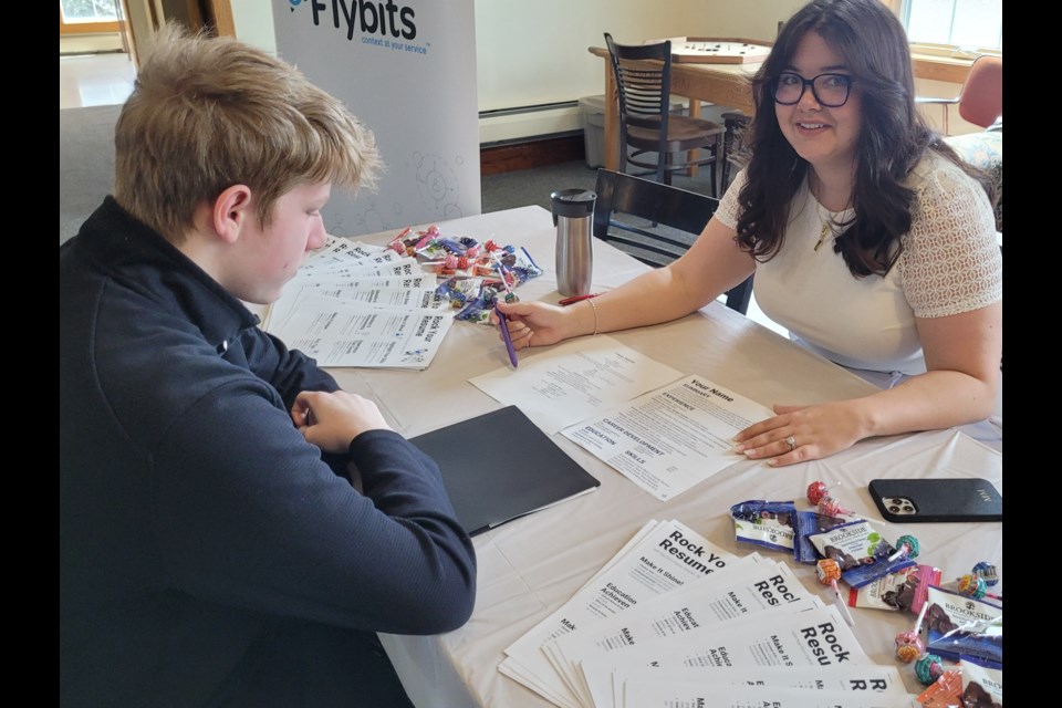 Student Dean Velsink and career coach Meghan Milner chat about job interviews and resumes at the NOTL Youth Collective Job Fairl