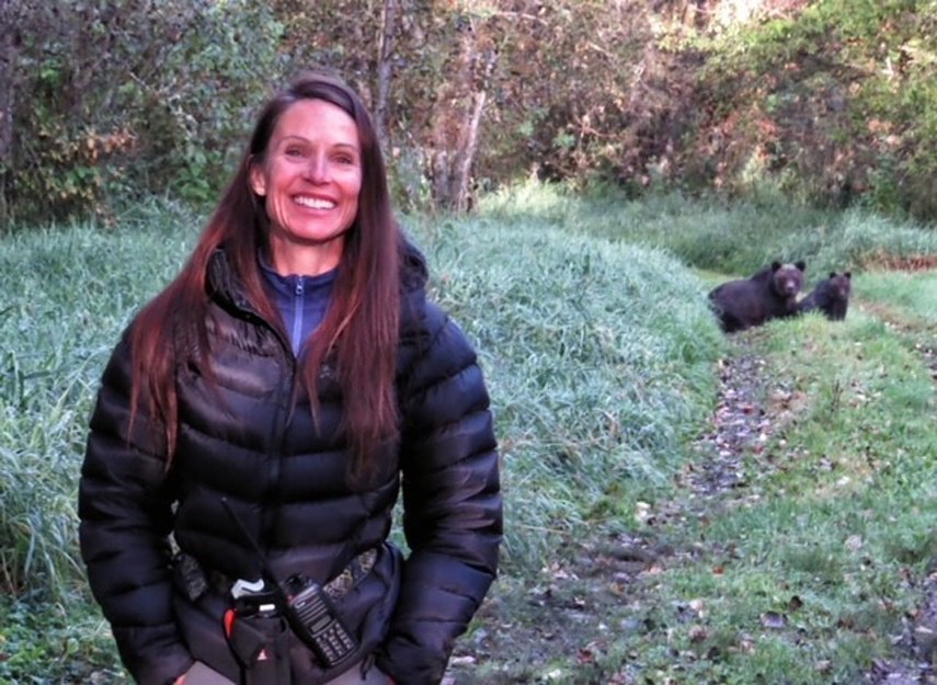 Bear behaviour expert Ellie Lamb is pictured with two of her favourite bears in the Bella Coola Valley, Ms. E and her cub Bandita.